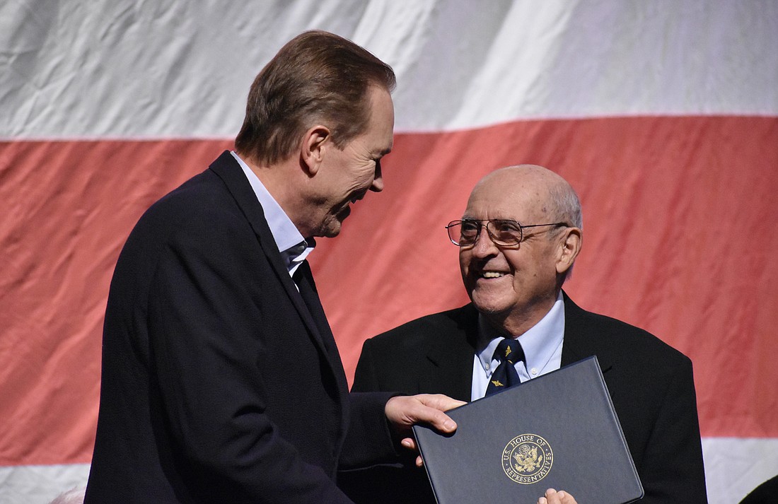 Congressman Vern Buchanan presents the Congressional Veteran Commendation award to Richard Petrucci. (Photo  by Ian Swaby)