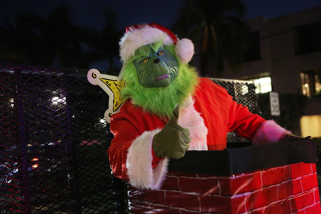 The Grinch himself joins the 2021 Village Holiday Parade on Siesta Key.