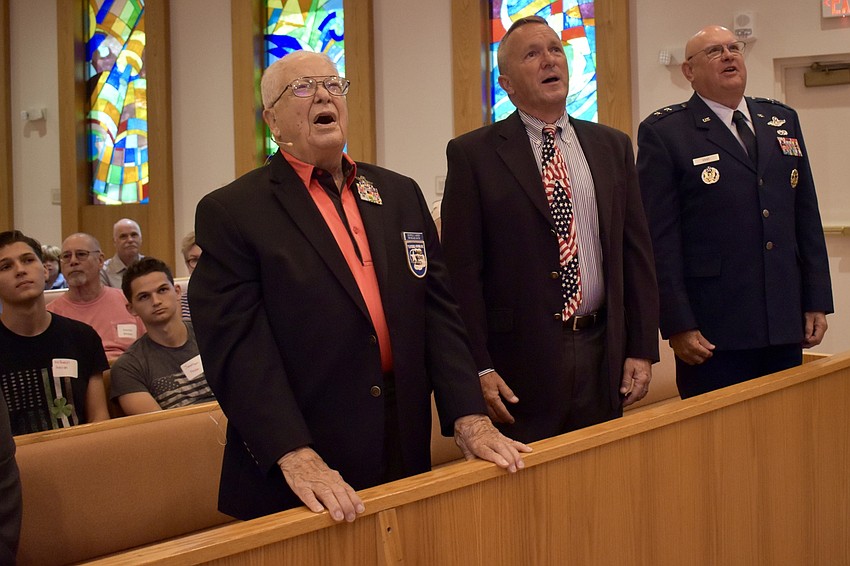 Lt. Col. George Hardy, Brigadier Gen. Scott Wuesthoff and Maj. Gen. Scott Gray sing for the Air Force during the Rotary Club of Longboat Key's 2022 Veterans Day event.
