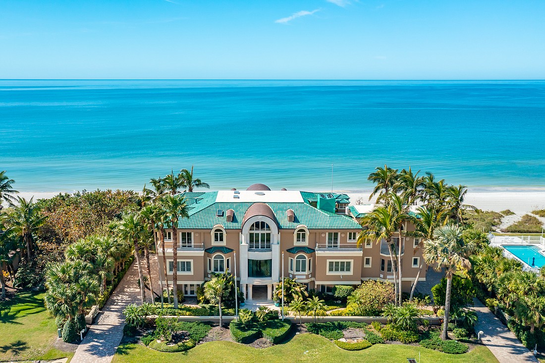 The property takes advantage of its scenic setting, with expansive windows, sliding doors and balconies overlooking the beach.  (Courtesy photo)