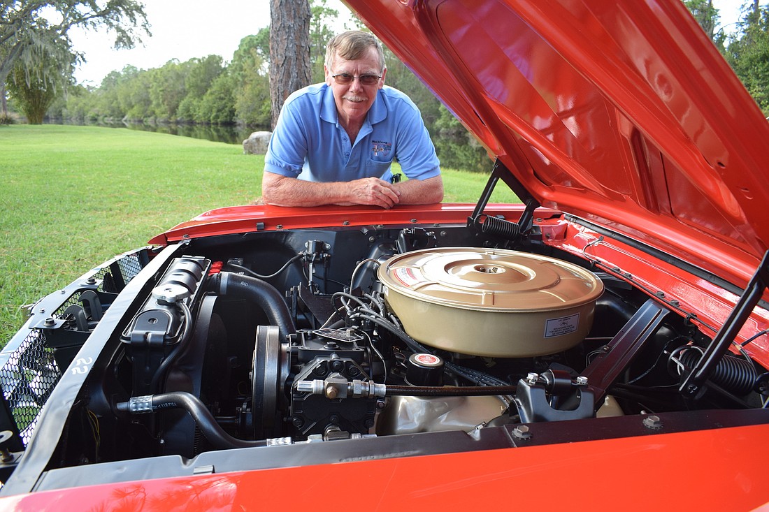 Ray Baker looks over the 289 cubic inch engine in his 1964 1/2 Mustang. (Photo by Jay Heater)