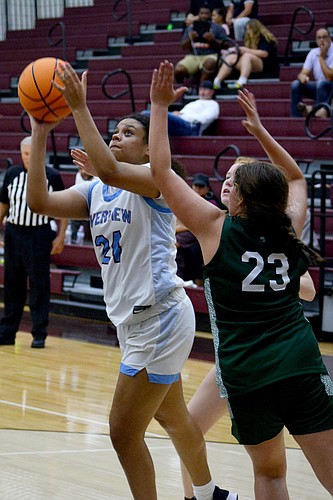 Krystal Montas (24), a senior, is a post presence for the Riverview High girls team. (Photo by Ryan Kohn.)