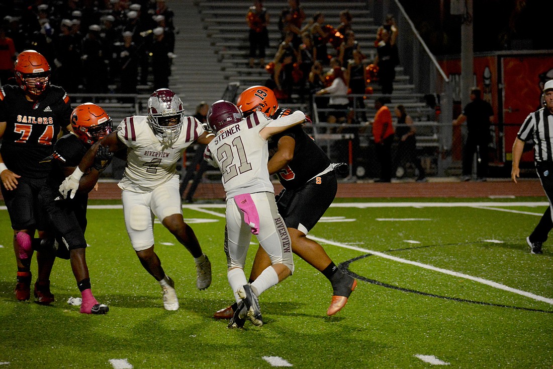 Riverview&#39;s Aidan Steiner (21) sacks Sarasota&#39;s Alexander Diaz in the first game between the two teams this season. (File photo.)
