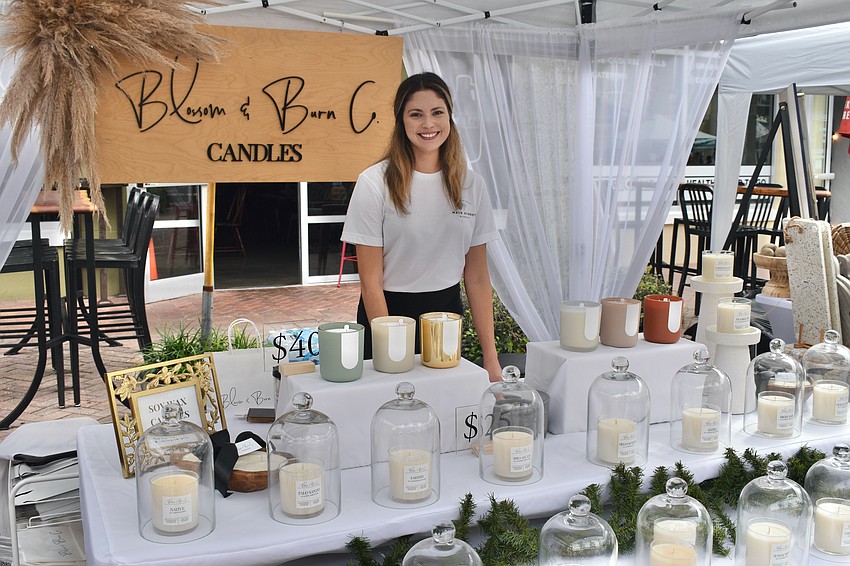 Lindsay Wood, who manages the market alongside Niki Dalsing, owns the small business Blossom and Burn Co.