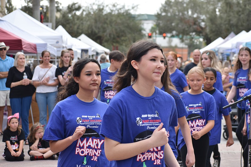 Bradenton's 16-year-old Micaela Walsh and Gates Creek's 14-year-old Hailey Lipham of the group Jump Encore, march about during a performance of 