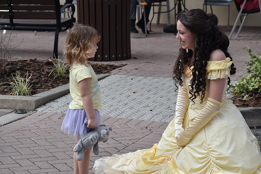 Tara's 3-year-old Blakely Bryan meets Mars Woelfel of Belle's Princess Parties.