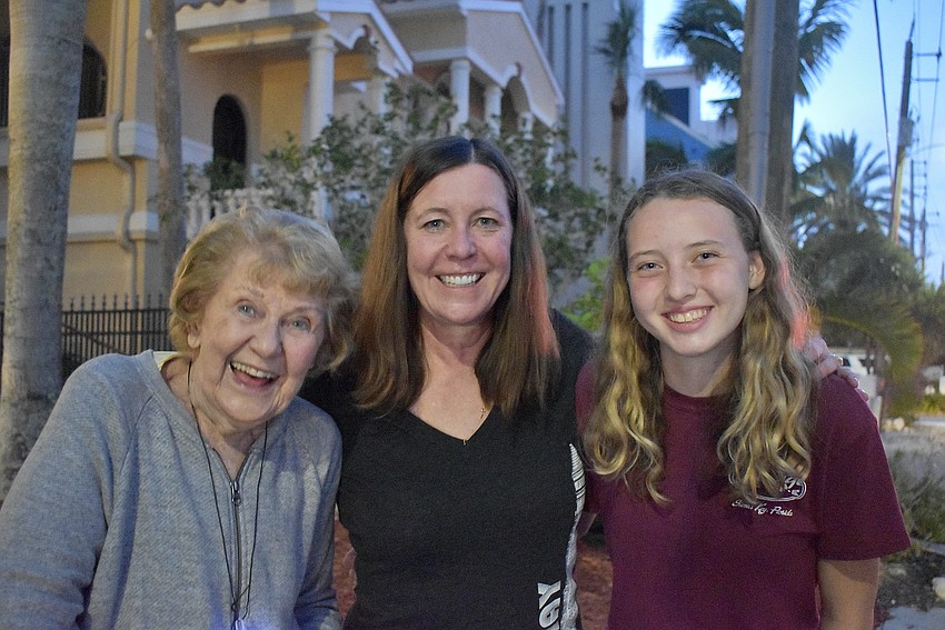 Marylu, Nancie and Isabelle Einess enjoy the parade's luminous lights and music.