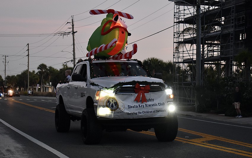 Siesta Key Kiwanis Club drives along Ocean Boulevard with a Santa float.