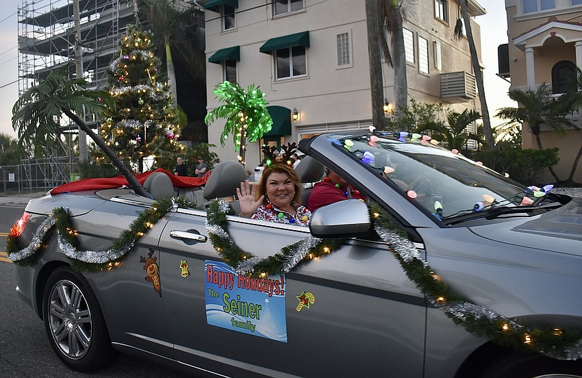 Becky Seiner waves at the crowd.