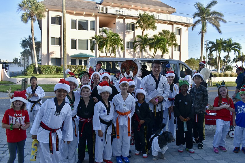Red Tiger Martial Arts waits for the start of the parade to walk.