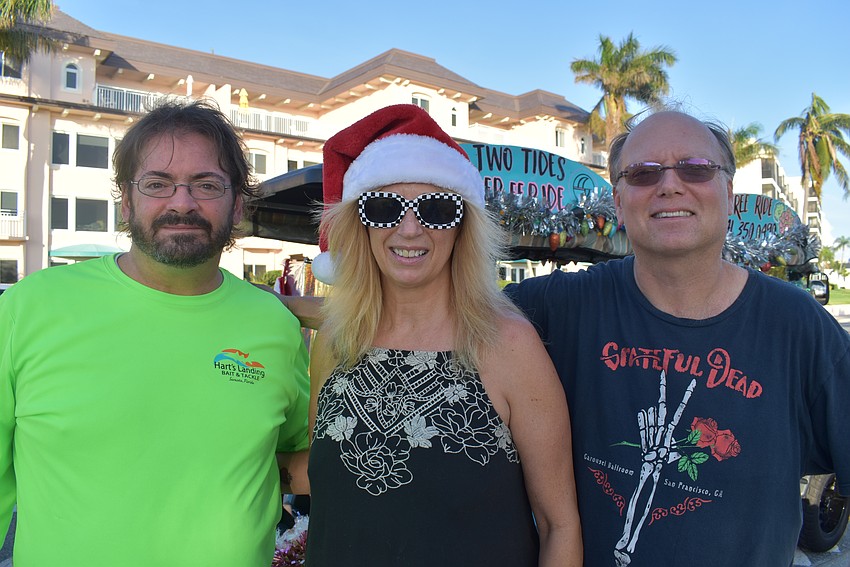 Joe White, Jeneva Hospodarsky and Ian Page represents Two Tides Free Ride in Light Up Siesta Key Parade.