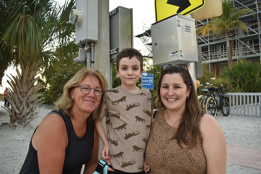 Lise, Leo and Julie Savaria waits for the parade to start.