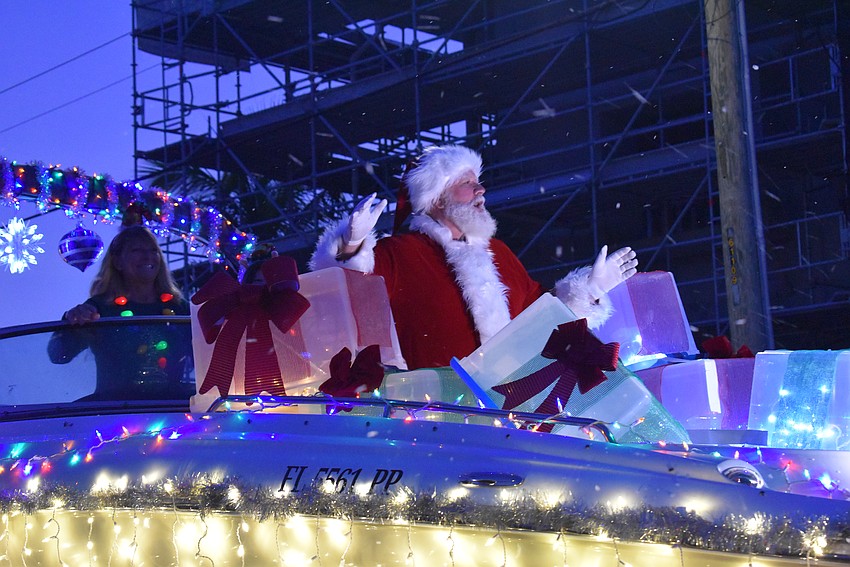Santa Claus makes his appearance in Light Up Siesta Key Holiday Parade.
