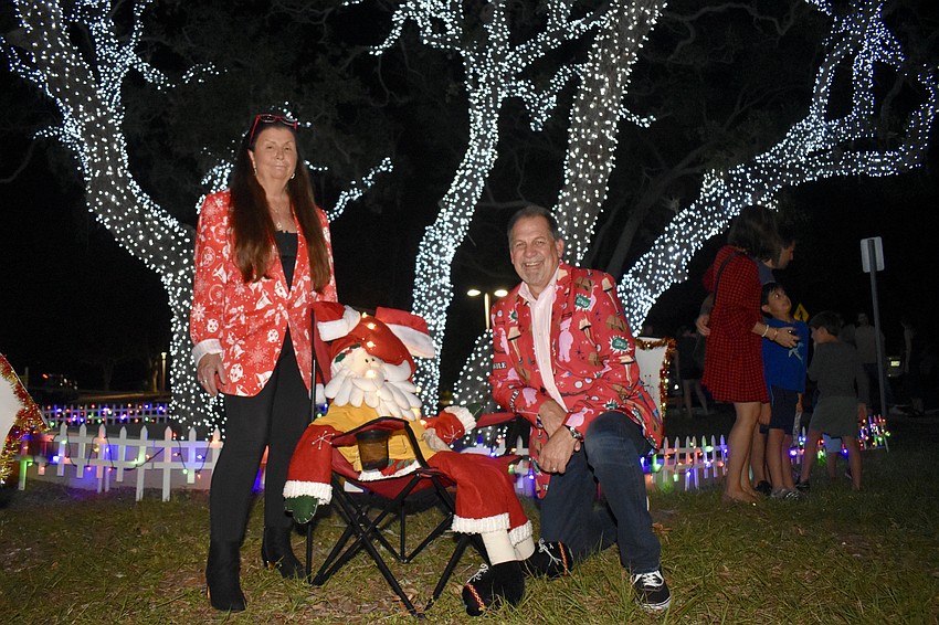 Donna and Mark Meador under the lights they help to set up each year.