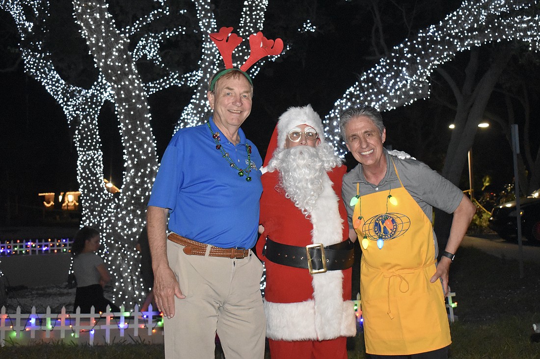 Rotary meets Kiwanis: Jack and Nancy "Santa" Rozance and Michael Garey.