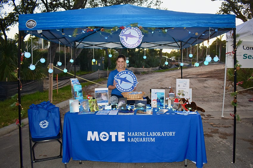 Betsy Kohl manning the Mote Marine Laboratory & Aquarium booth.