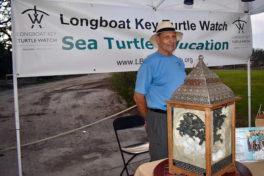 Sam DiGiammarino Jr. manning the Longboat Key Turtle Watch booth.