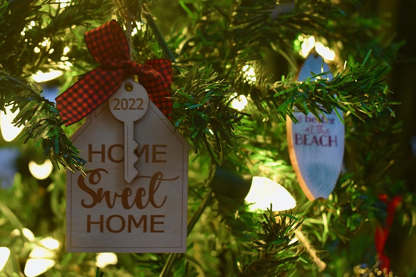 The tree from Realtor JoDene Moneuse with Michael Saunders & Company is aptly decorated with homes and keys.