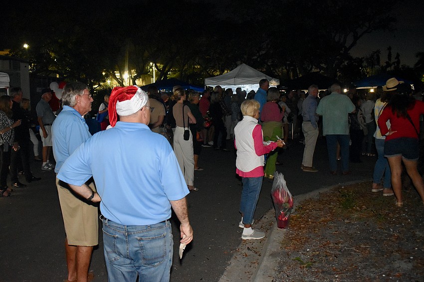 Town Center Green is packed with elves for Light up Longboat Saturday night.
