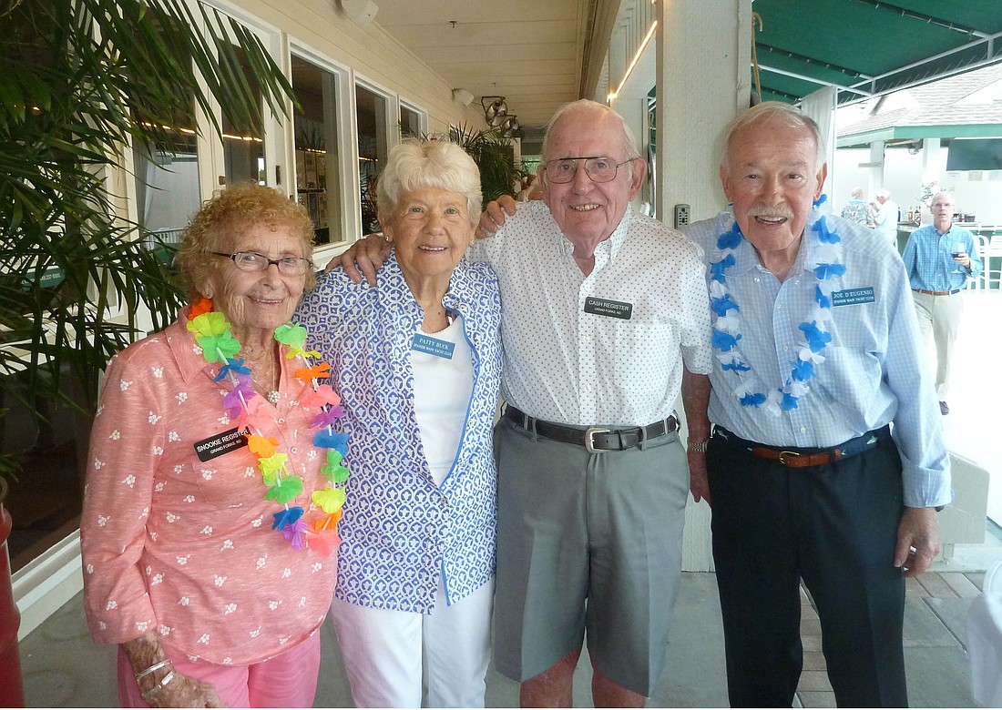 Snookie Register, Patty Buck, Cash Register and Joe D'Eugenio celebrate in a tropical way.
