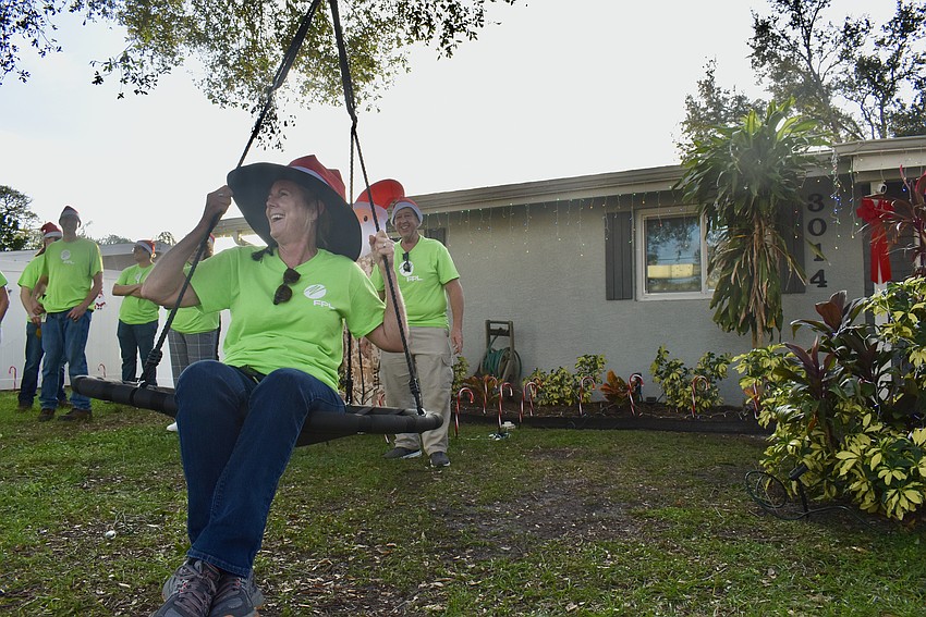 Kelli Gross and Mike Catarzi have a little fun as they wait for the arrival of the Moreira family.
