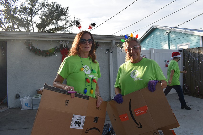 Lisa Barker and Barbara Carroll starts cleaning up for the grand arrival of the Moreira family.