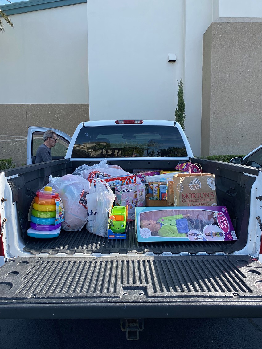 Mike McCulough's truck getting filled during the toy and food drive on Wednesday.