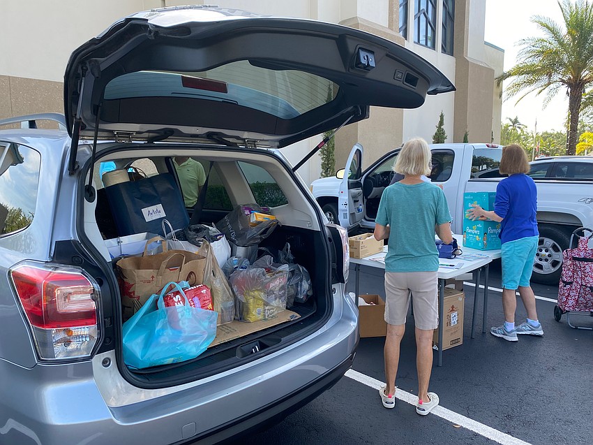 Christ Church members collect two carloads of food and toys for Our Daily Bread of Bradenton.