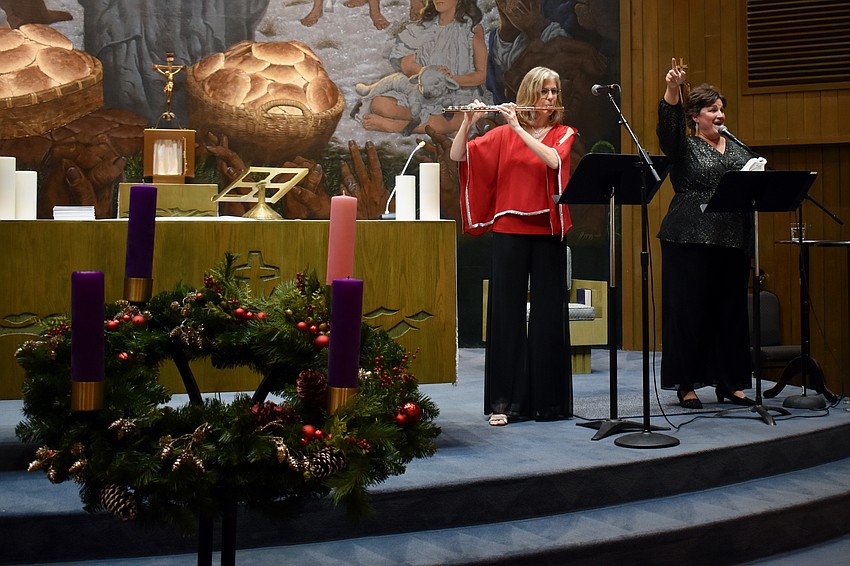 Karen Romig and Jennifer Harris perform at St. Mary Star of the Sea Catholic Church on Friday.
