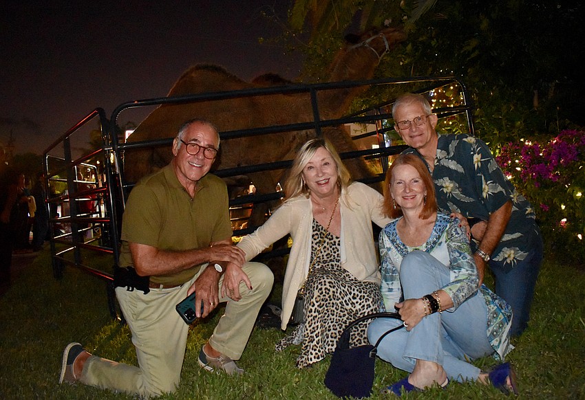 George and Carol Taylor with Cathy and Jan Voigts and a camel.