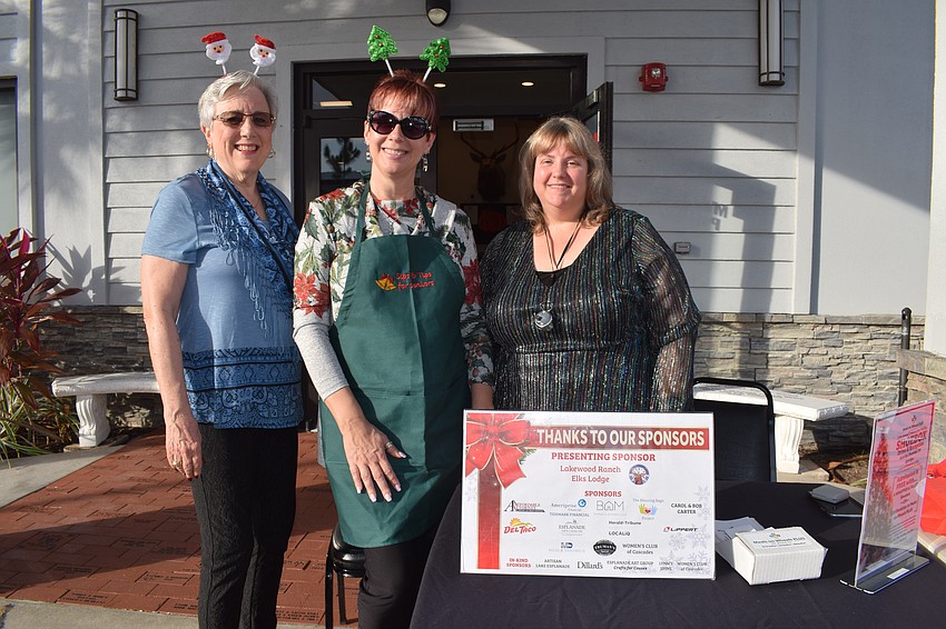 Bradenton's Gini Mitchell, East County's Shawna Cranston and Lakewood Ranch's Christina Ballard greet people and collect shoeboxes.