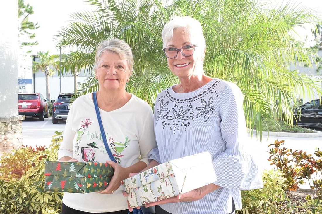 Esplanade at Lakewood Ranch's Gwyneth Paget and Sarah King drop off shoeboxes. They are a part of Esplanade at Lakewood Ranch's Crafts for Cause, which donated 150 shoeboxes and $365 to Meals on Wheels Plus of Manatee.