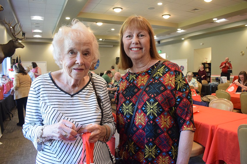 Bradenton's Mary Francis-Schultz and Terry Remijio have fun at the Shoebox Drive and Reception.