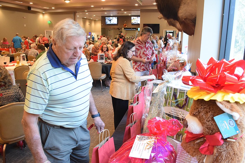 East County's Lynn Suter sees what's available in the raffle.