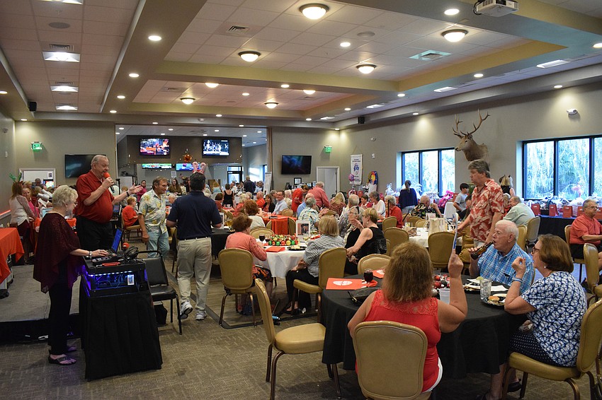 Dozens of people enjoy the Meals on Wheels Plus of Manatee shoebox collection at the Lakewood Ranch Elks Lodge.