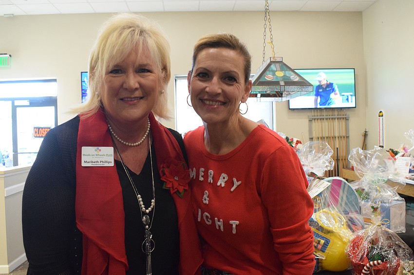 Maribeth Phillips, the CEO and president of Meals on Wheels Plus of Manatee, and Jackie Barron, the board chair of Meals on Wheels Plus of Manatee, are excited to see how many shoeboxes the nonprofit collected.