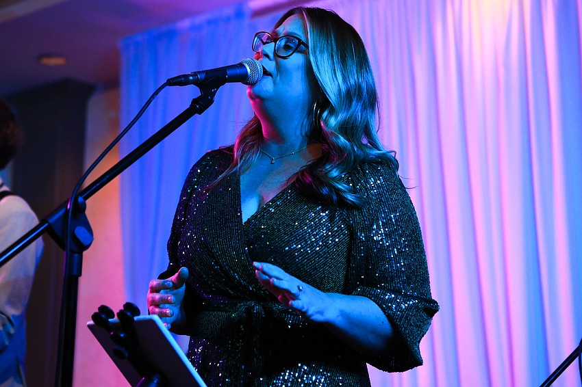 Robyn Baker of the Ovation band belts out some tunes.