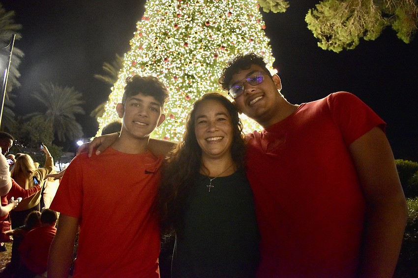 Andrew, Jeannie and Nikolas Sibilly pose in front of the St. Armands Tree.