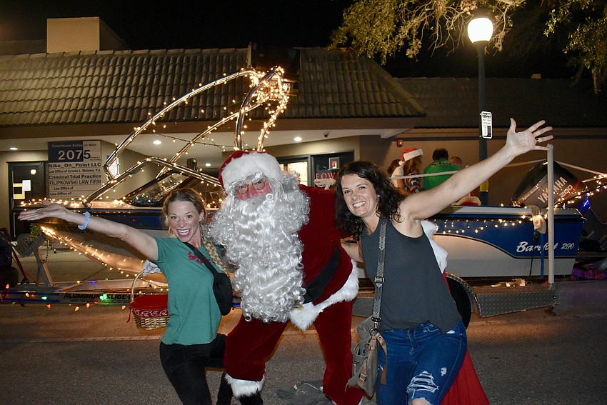 Leah Nicole, Santa and Leah Pagh rejoice in holiday parade spirit.