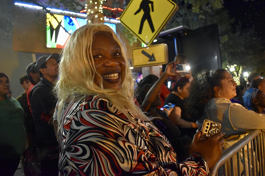 Kimla Murrell cheers at the parade floats.