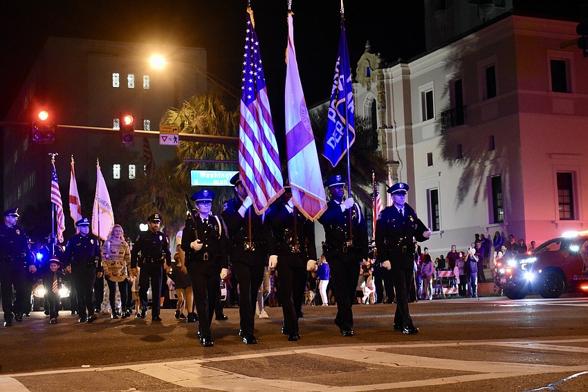 Sarasota Police Department starts the holiday parade.
