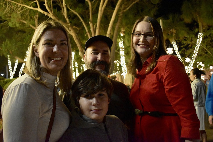 Jacalyn Ochoa, John Ochoa, Harrison Ochoa and Ciera Coleman pose next to the St. Armands Tree.