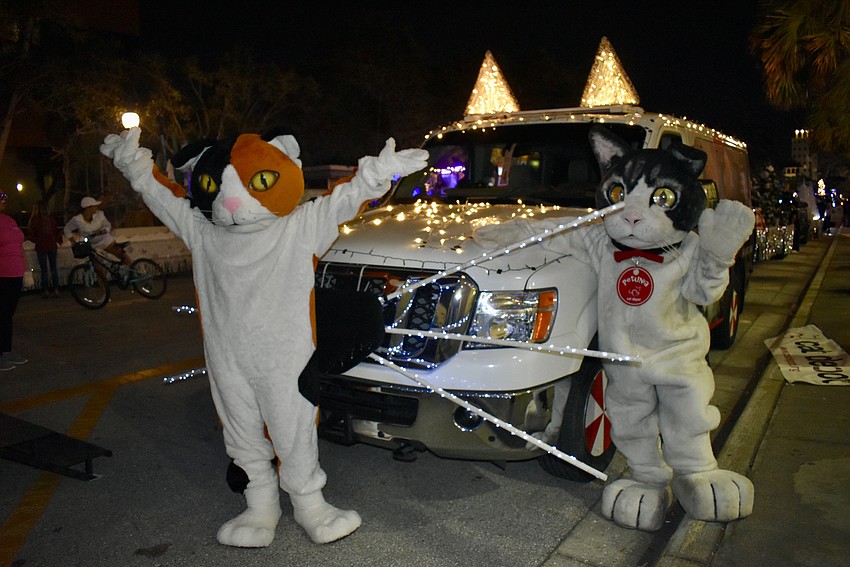 Cali and Petunia walk with Cat Depot float.