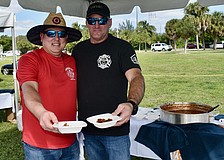 Jason Berzowski and Tim Haas of the Longboat Key Fire Rescue serve up their award-winning firehouse chili.