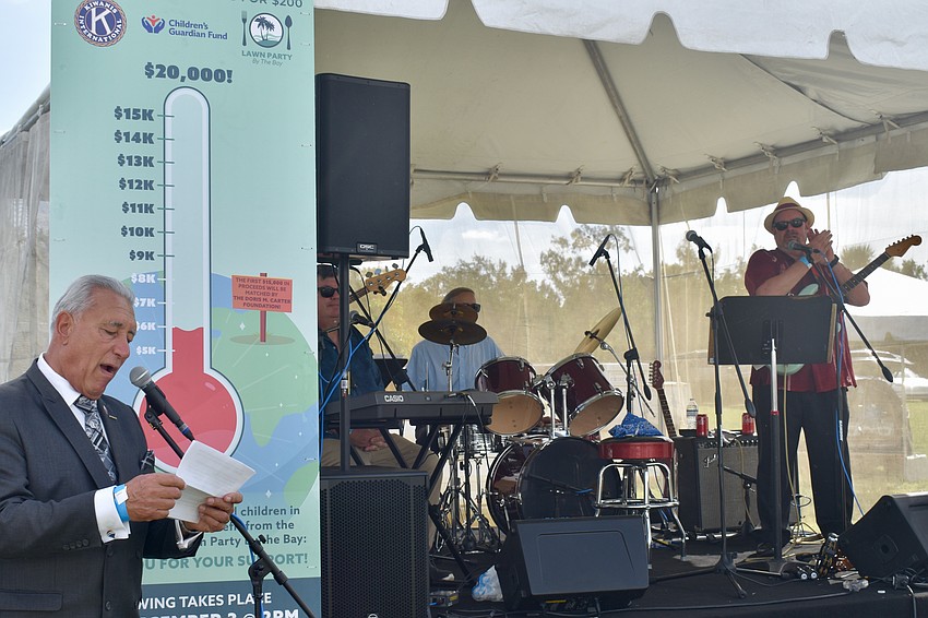 Kiwanis club member Andrew Vac emcees the event.