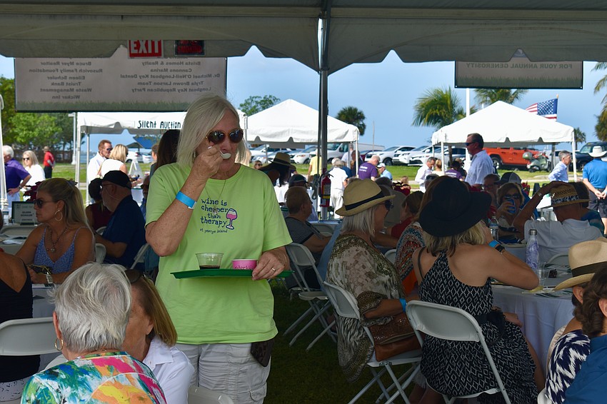 Jean Raymond enjoys a taste of Tyler's Gourmet Ice Cream.