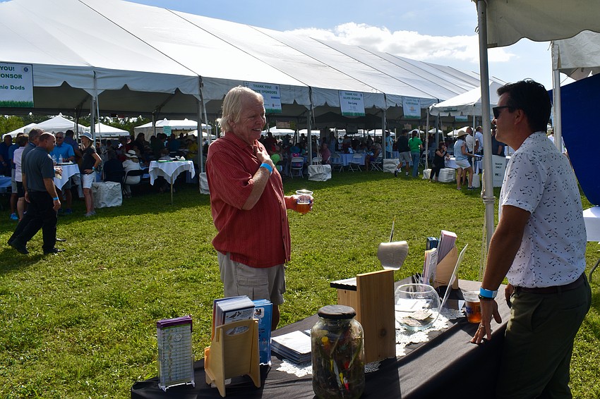 Chris Wells learns more about Save Our Seabirds from CEO Aaron Virgin.