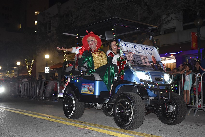 Grandma Pearly waves at the parade goers.