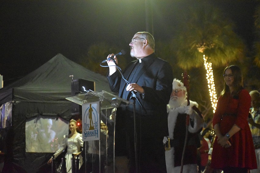 St Armands Key Lutheran Church Rev. Dr. Kenneth Blyth gives a prayer before the tree lighting.