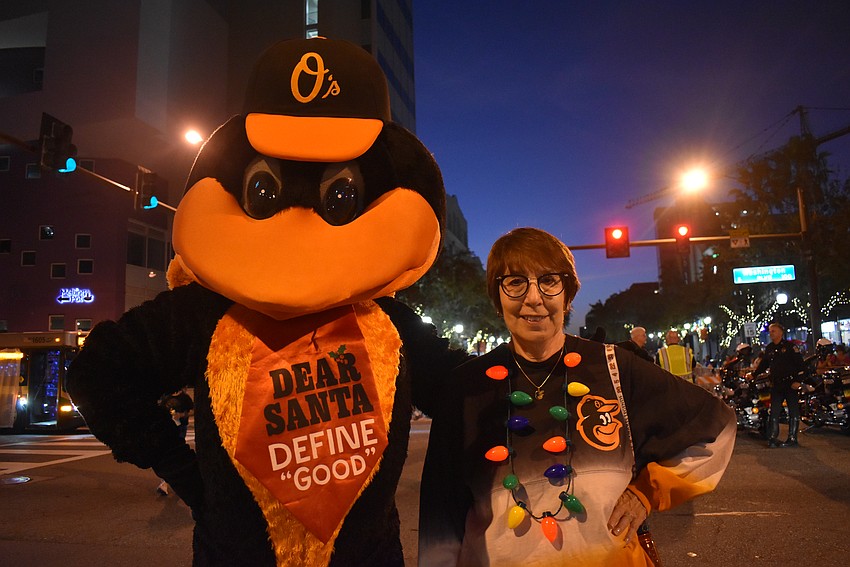 The Oriole Bird with Kathy Hultquist at the front of the Sarasota holiday parade line.